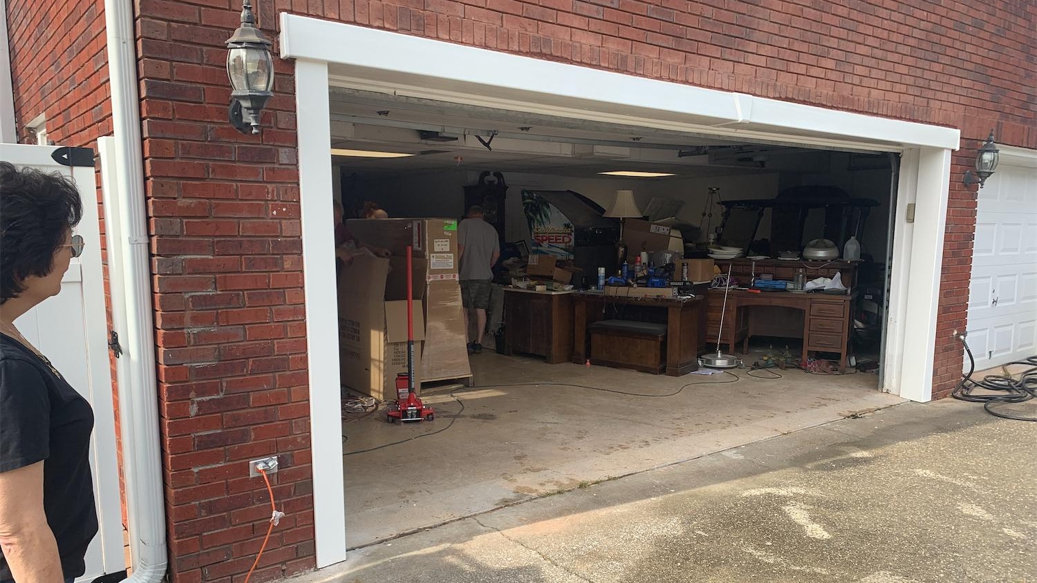 After: the garage door header rebuilt straight and square by APS Foundation Repair, with new white trim installed