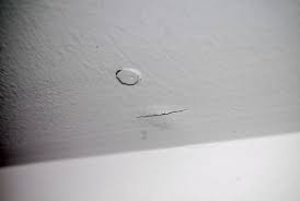 Cracks in Walls & Floors on an Alabama home, photographed on an APS Foundation job site