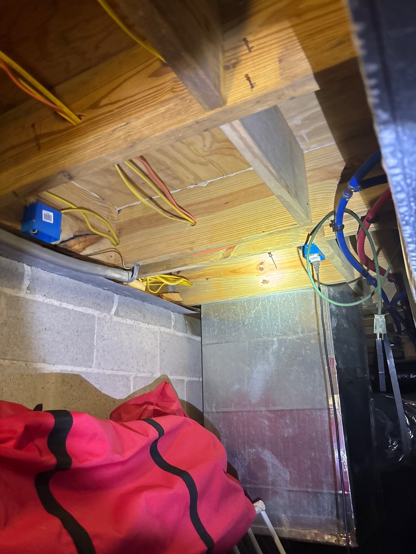 APS Foundation Repair and Waterproofing showcasing crawl space moisture control system with vapor barrier and support jacks