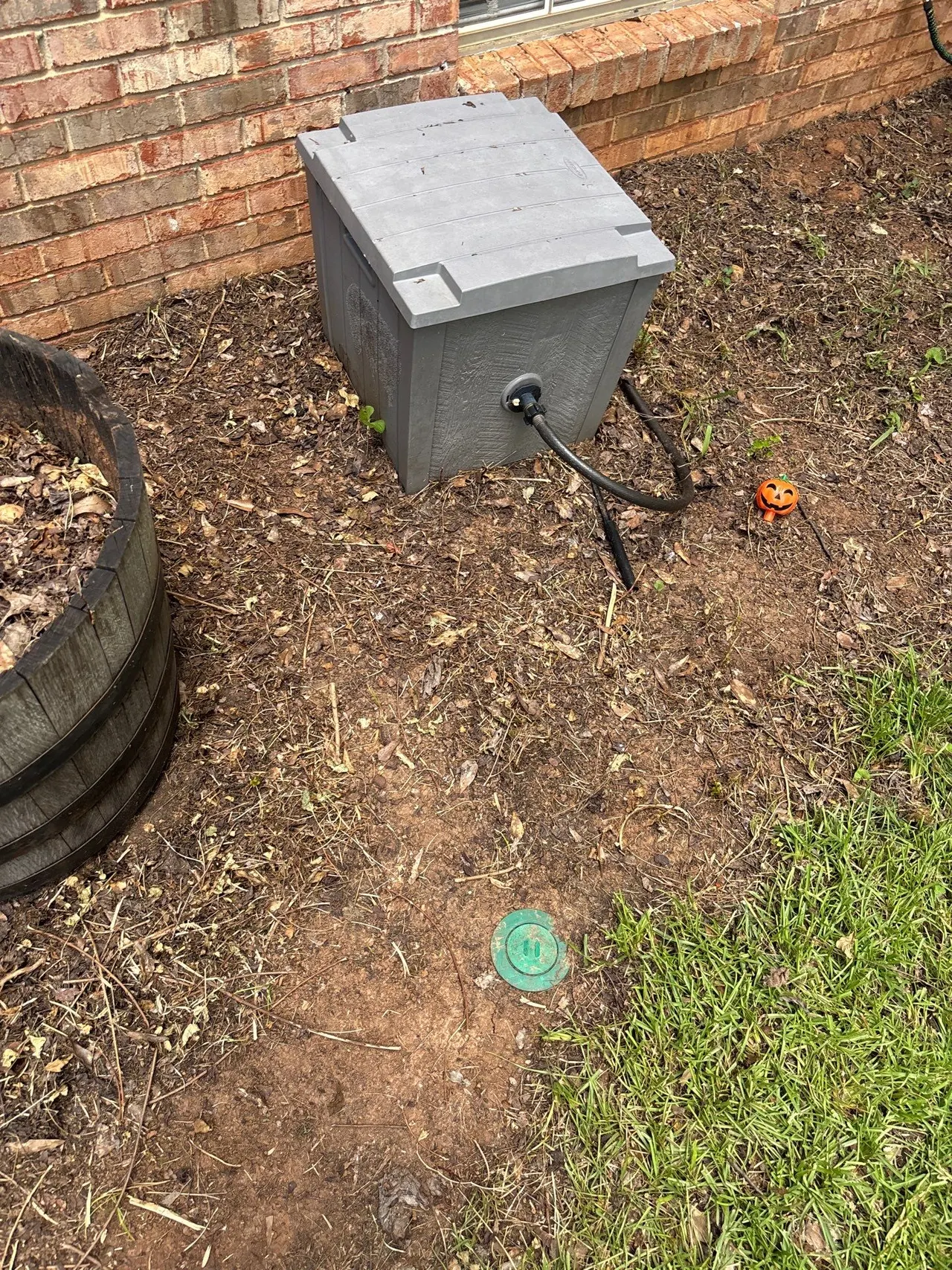 APS Foundation Repair and Waterproofing installing an exterior drainage system with a sump pump enclosure in Helena, AL.