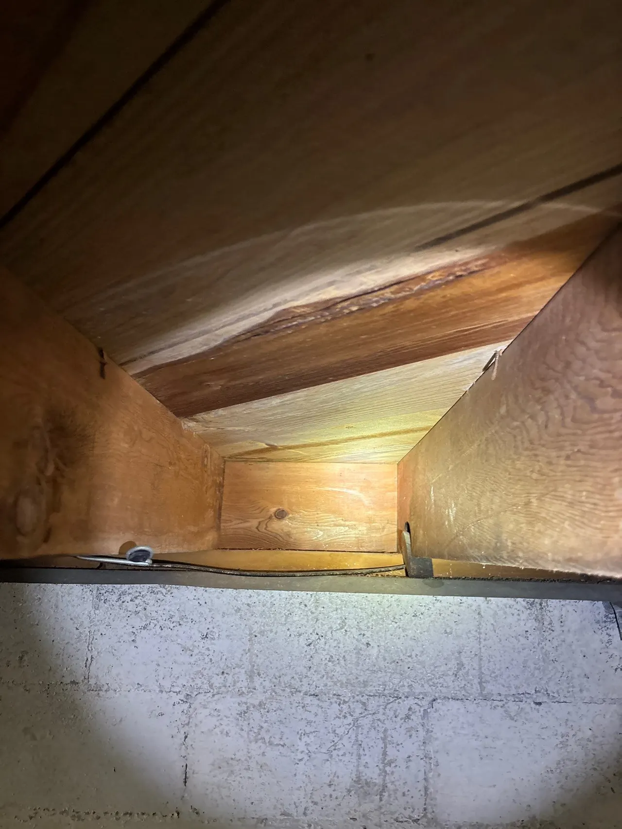 APS Foundation Repair and Waterproofing inspecting broken and cracked floor joists with mold in a crawl space, Columbiana
