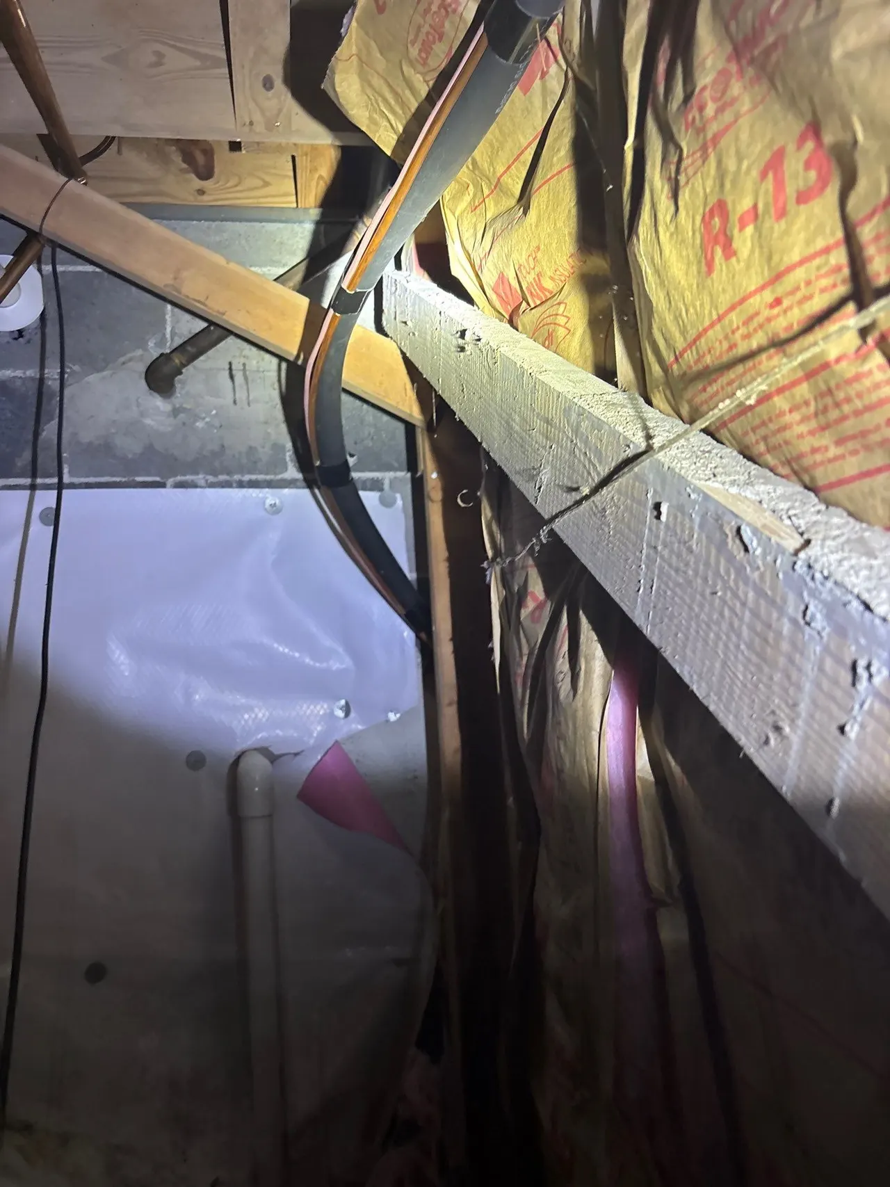 APS Foundation Repair and Waterproofing installing a vapor encapsulation liner and insulation in a crawl space