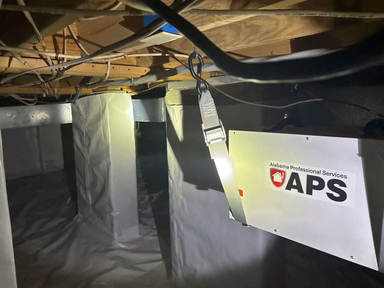 APS Foundation Repair and Waterproofing showcasing crawl space moisture control system with vapor barrier and support jacks