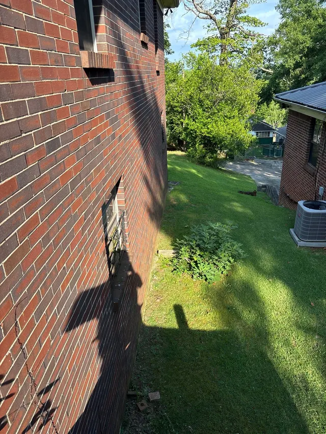 Diagonal Foundation Cracks at Door and Window Corners on an Alabama home, photographed on an APS Foundation job site